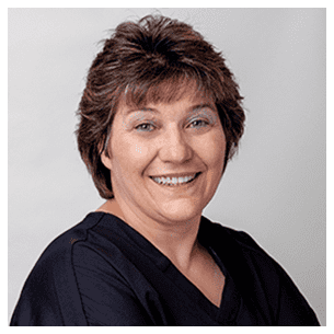 Anne Gage, Certified Dental Assistant at The Dental Studio, assisting with state-of-the-art dental procedures